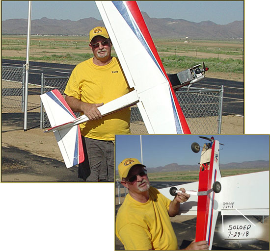Paul "Pauly" Forsyth proudly holds his trainer after his solo flight... Well done!